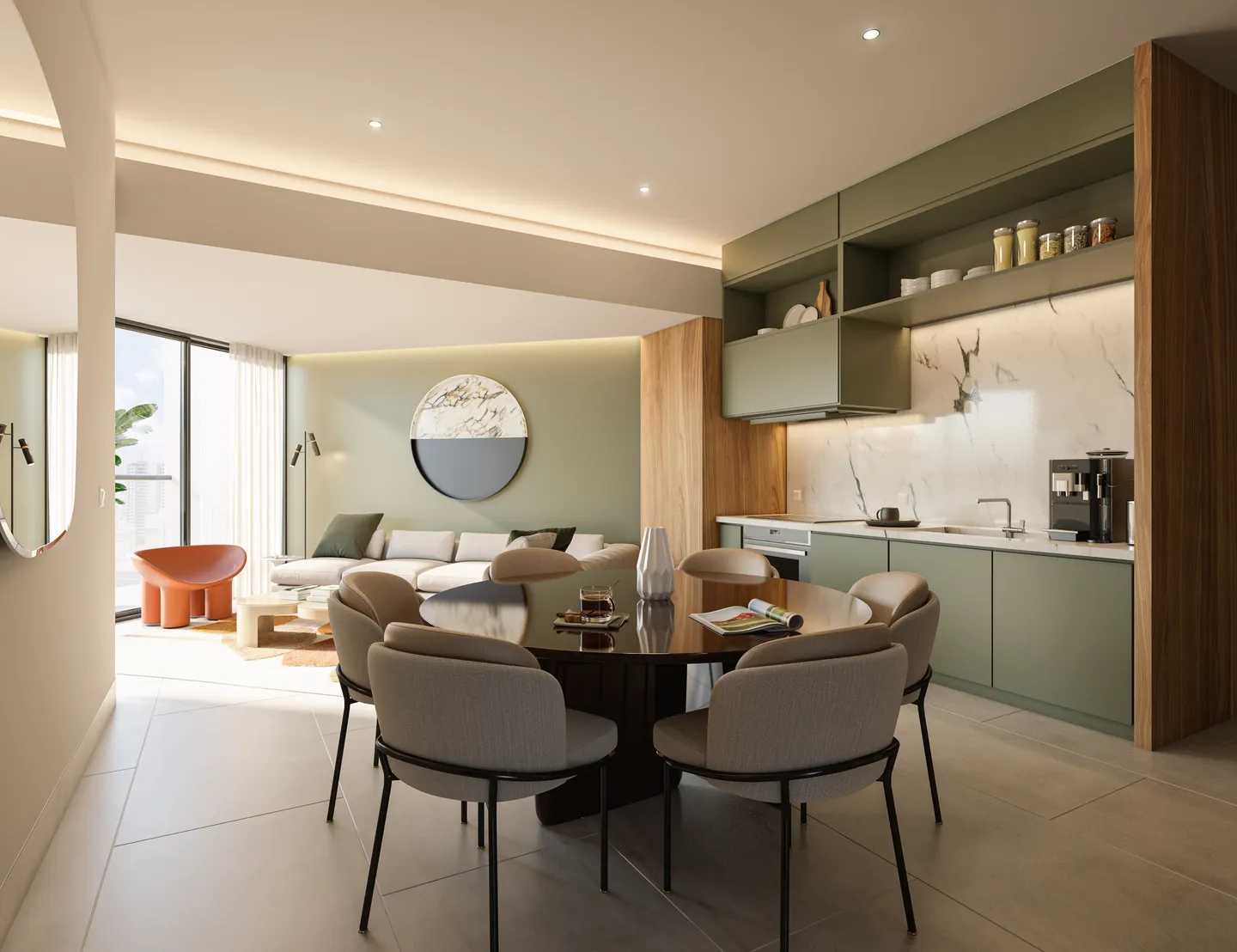 Round dining table next to the green kitchen and the living room of a residence
