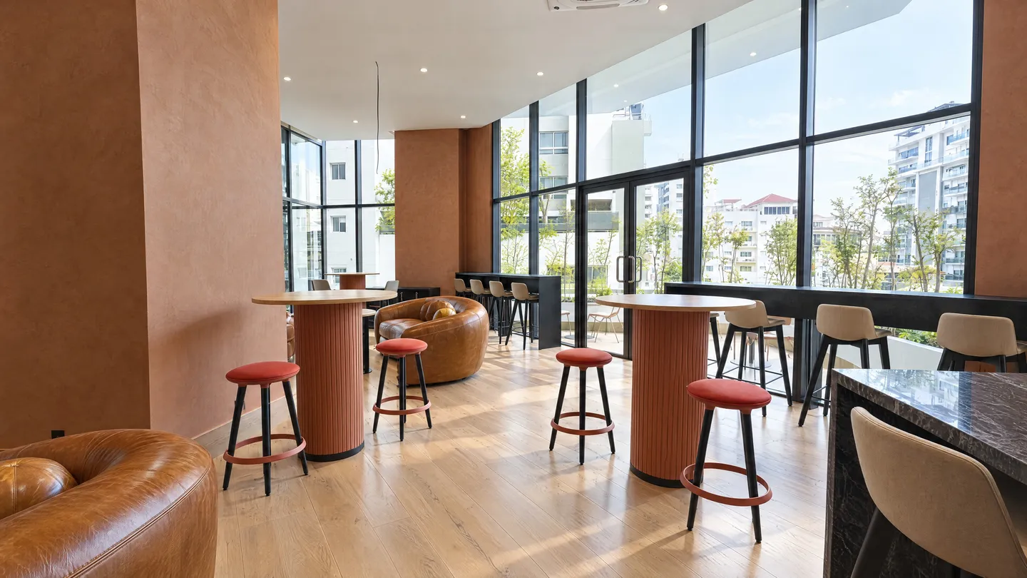 Social area lounge with leather armchairs and a bar