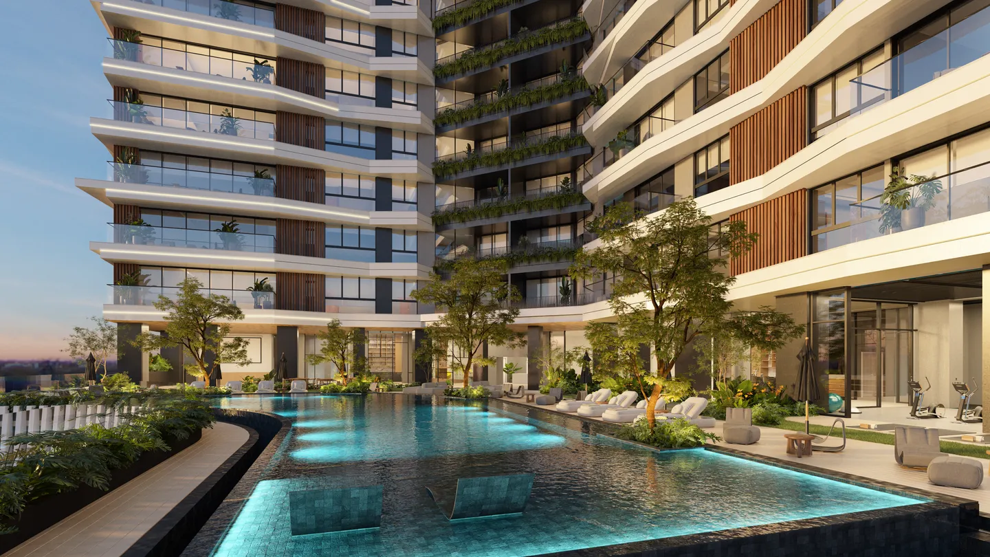 Social-level pool at sunset with the tower in the background