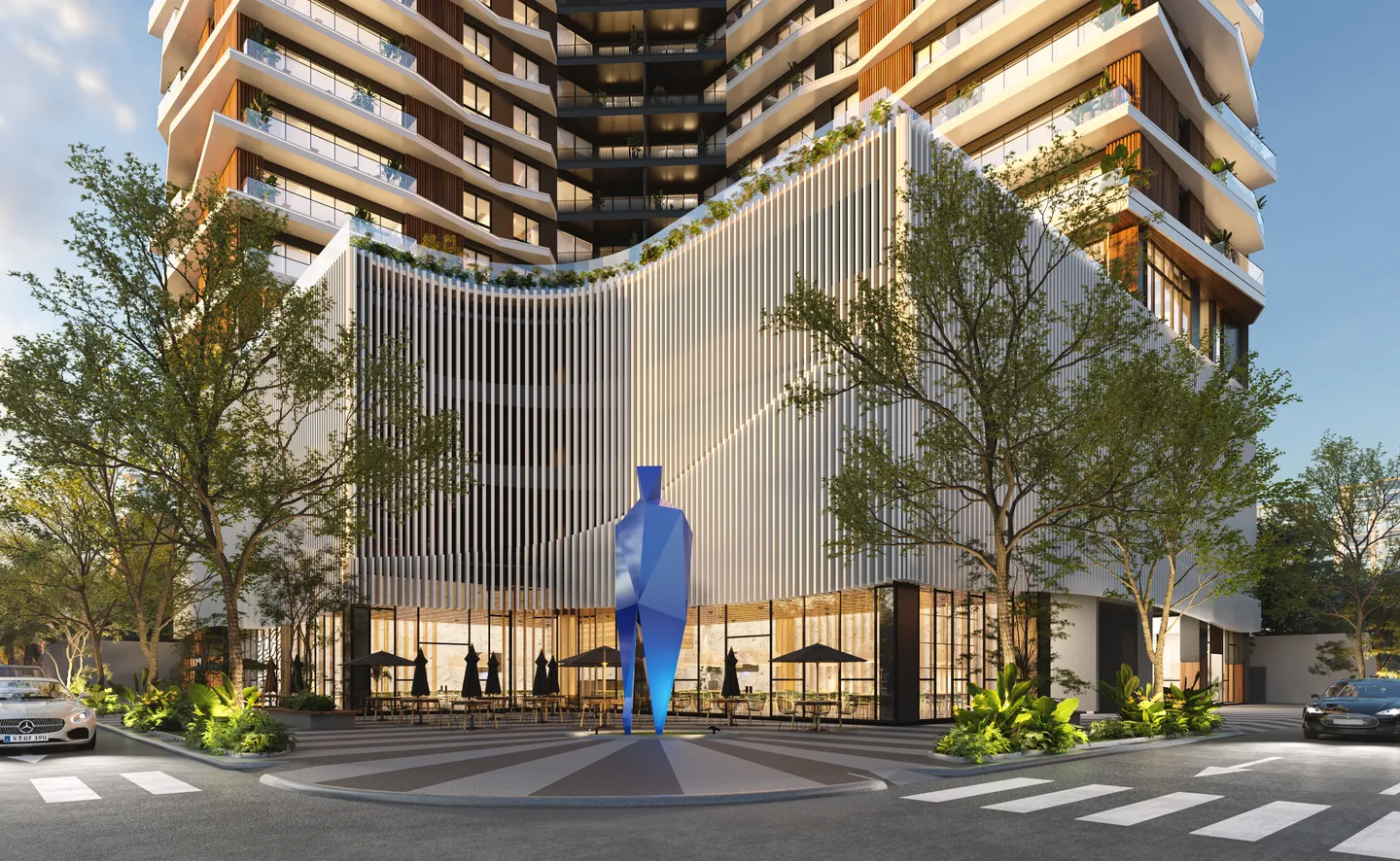 Torre Parkside plaza with the blue sculpture by master artist Fernando Varela in front of the white-slatted podium