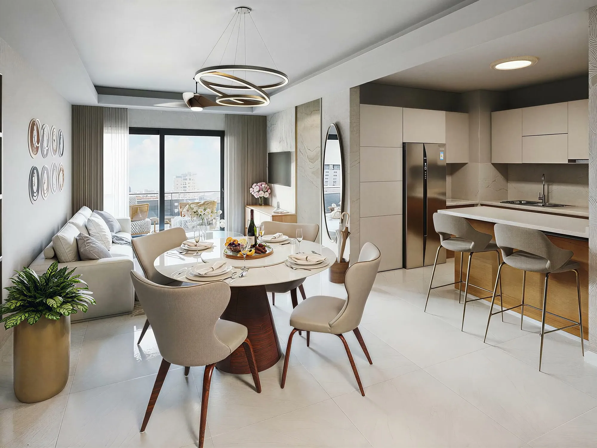 Living room, round dining table and open kitchen with an island in a Brisas de las Colinas 6 residence