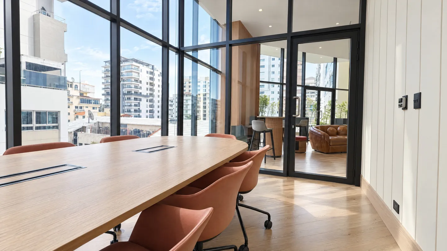 Meeting room with a long table and large windows