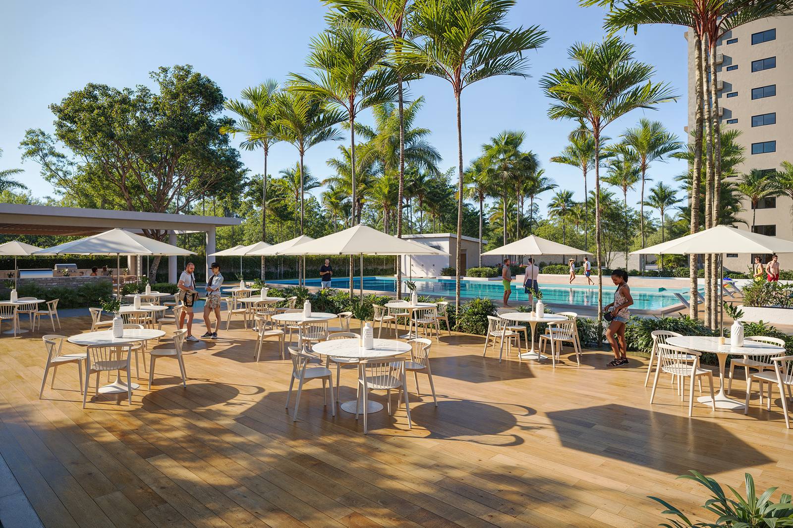 Brisas 6 pool terrace with tables, umbrellas and palm trees