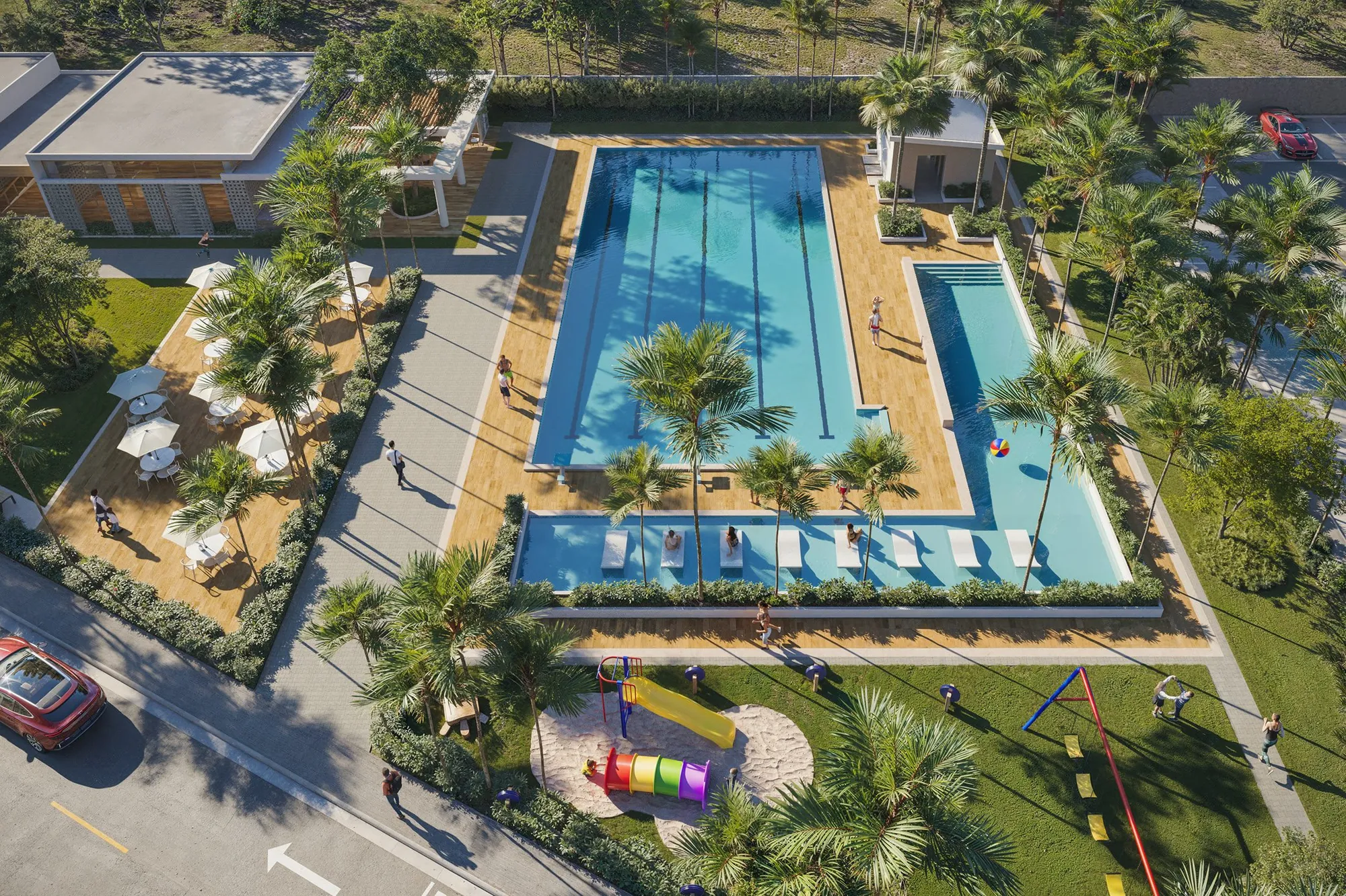 Aerial view of the Brisas 6 semi-Olympic pool surrounded by a terrace, umbrellas and green areas